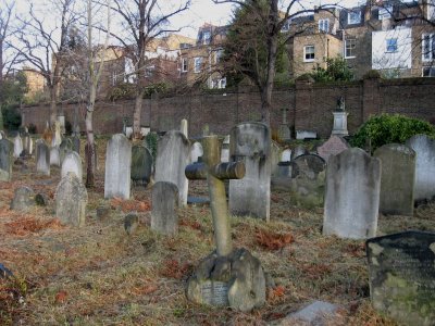 houses beyond the cemetery wall